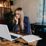 Freelancer working on a laptop to make money online from home in 2025